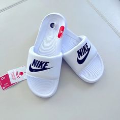 Nike | Shoes | Nike Slides | Poshmark White Open Toe Slides For Sports, Non-slip White Sandals For Streetwear, White Non-slip Sandals For Streetwear, White Slip-on Sandals For Streetwear, Nike White Sandals For Streetwear, White Nike Sandals For Streetwear, White Sporty Sandals With Cushioned Footbed, Nike White Non-slip Slides, Nike White Sandals For Spring