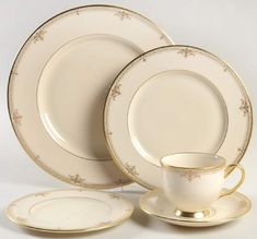 a white and gold china dinner set