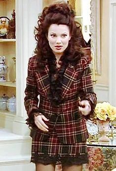 a woman is standing in front of a bookcase wearing tights and heels with her hands on her hips