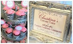 cupcakes are displayed in front of a framed sign and on the table is a cake stand