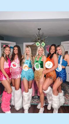 a group of women in costume posing for a photo