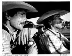 black and white photograph of two men in cowboy hats, one with his hand on the other's shoulder