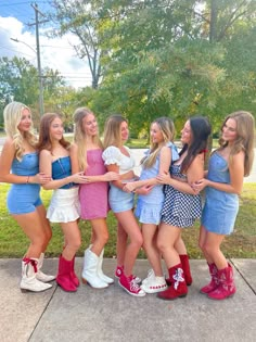 a group of young women standing next to each other