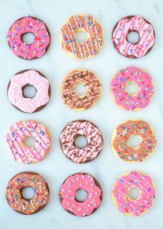 six donuts with sprinkles on them are arranged in a grid pattern