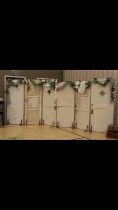 the room is decorated with white doors and ivys on them, along with other decorations