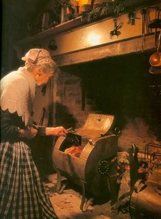 an old woman is cooking food in the kitchen