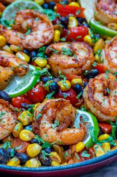 shrimp and corn salad in a blue bowl