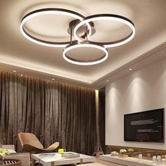 a modern living room with round lights on the ceiling