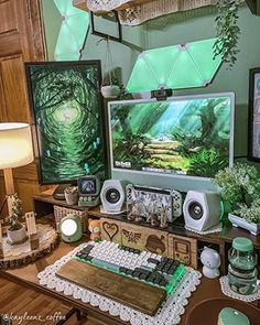 there is a computer on the desk with many decorations around it and pictures hanging from the wall