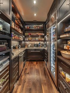 a kitchen filled with lots of appliances and wooden flooring next to a wall mounted oven