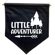 a black banner that says little adventurer with trees and an arrow hanging from the side