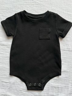 With a classic baby style and a good dose of retro charm, this rolled sleeve, patch pocket baby bodysuit is the perfect staple to add to your child’s wardrobe. We’ve finished it with popper fastening at the crotch for easy diaper changes and a crew neck collar. Baby Style, Short Sleeve Bodysuit, Neck Collar, Shorts With Pockets, Baby Bodysuit, Baby Fashion, Patch Pocket, Onesies, Baby Onesies