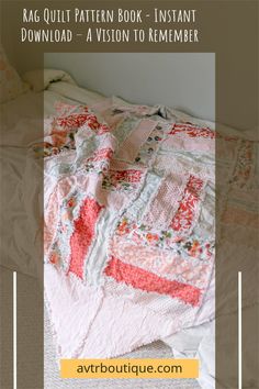 an unmade bed with pink and orange quilts on the top, next to pillows