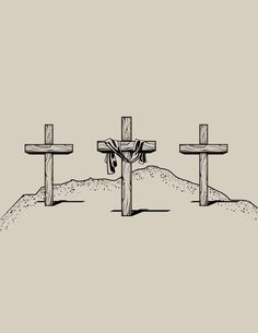 three crosses in the sand with a rope tied to them