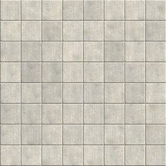 a white brick wall textured with small squares in grey and light gray tones, suitable for use as a background or backdrop