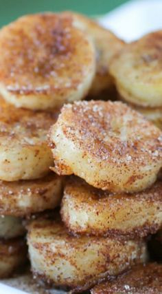 some bananas are stacked on top of each other with powdered sugar and cinnamon sprinkles