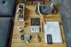 a wooden table topped with assorted items on top of it