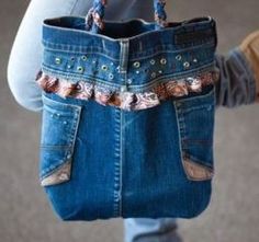 a person holding a blue purse with holes in the front and side pockets on both sides