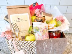 a basket filled with lots of food on top of a counter next to a sign