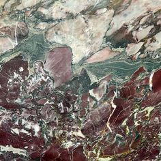 an abstract marble pattern with red and green colors on it's surface is shown in this image