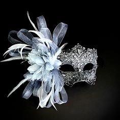 Masquerade masks in dark silver. Simplistic for woman with a gray floral- destined to pop out at any event, wedding etc The dark silver women lace mask is veil decoration with feather and blossoming branches. This masquerade mask is great for any occasion. White And Silver Masquerade Mask, Silver Masquerade Mask, Masquerade Mask Women, Mask Ball, Ball Mask, Feather Mask, Party Mask, Masquerade Masks, Lace Mask