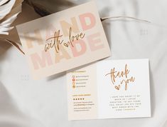 wedding stationery and thank you cards on a bed