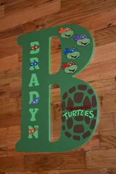 the letter b is decorated with teenage mutant turtles