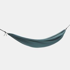 a blue hammock hanging from a rope