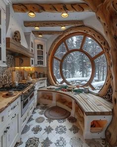 a kitchen with a large round window in it