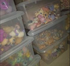 several plastic containers filled with little pony toys