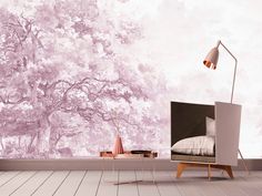 a bedroom with a tree mural on the wall next to a bed and side table