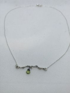 This simple delicate necklace is so beautiful.  The peridot is like  a little leaf on the branch.   Necklace is approx. 16" in length.   The branch charm is silver plated.    Earrings are sold separately.  Known as the stone of compassion, peridot is believed to bring good health, restful sleep and peace to relationships by balancing emotions and mind. This friendly bright green stone also has the uncanny ability to inspire eloquence and creativity; it also brings delight and good cheer. A percentage of sales are donated to the Colorado Trans-Youth Education and Support group. The Uncanny, Good Cheer, Green Stone, Bright Green, Delicate Necklace, Colorado, Favorite Jewelry, Necklace Etsy, Jewelry Necklace Pendant