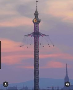 a tall tower with a clock on it's side next to a sky background