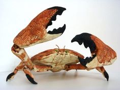 two figurines made to look like crabs