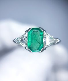 Very well-made platinum three stone ring with a natural emerald center flanked by two natural trillion shaped diamonds. Emerald: ~1 ct finer crystal material. Diamonds: ~1 ctw for the two diamonds (6.4mm triangles). Ring size 7.0. Ring weighs 5.75 grams. Free shipping within the USA! 100% money back guarantee if you're not satisfied! Three Stone Ring, Platinum Ring, Three Stone Rings, Natural Emerald, Emerald Diamond, Ring Size 7, Three Stone, Stone Ring, Platinum