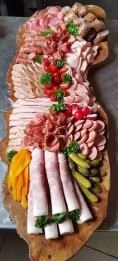 an assortment of meats and vegetables on a platter