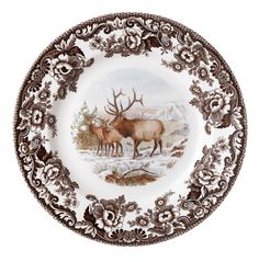 a brown and white plate with an elk scene on it