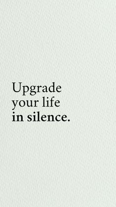 the words upgrade your life in silence are written on a white paper with black lettering