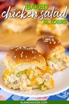 two chicken salad sliders on a white plate with blue and red checkered tablecloth