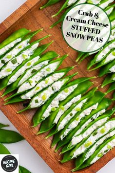 crab and cream cheese stuffed snow peas on a wood platter Stuffed Snow Peas, Crab And Cream Cheese, Snow Peas Recipe, Lake House Food, Peas Recipe, Elegant Appetizers, Lake House Food Ideas, Lake Food Ideas Summer, Food Ideas Summer