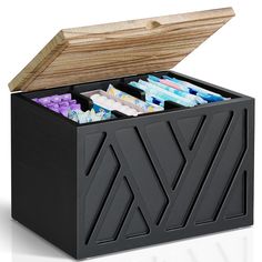 a black box filled with lots of different types of candy in it's lid