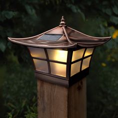 a light that is on top of a wooden post