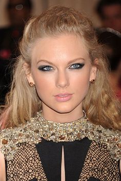 a close up of a person wearing a black dress