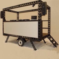 a small black and white cart with wheels