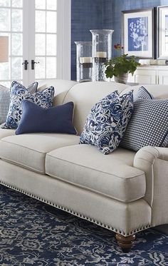 a living room filled with furniture and blue walls