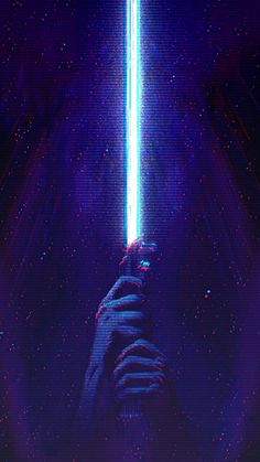 a person holding a light saber in their hand with purple and blue lights behind them