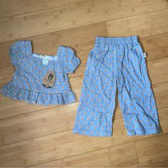 Nwt Girls Size 2t Blue Print Outfit - Ruffle Top & Pants Playful Cotton Bottoms In Matching Set, Cute Spring Sets With Elastic Waistband, Casual Cotton Sets With Ruffles, Casual Cotton Ruffle Sets, Casual Cotton Ruffled Sets, Cute Light Blue Sets For Playwear, Light Blue Casual Playtime Sets, Casual Ruffle Bottoms For Playwear, Light Blue Casual Sets For Playtime