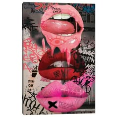 pink and red lips with graffiti on the wall behind them, framed in black wood frame