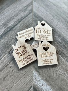 personalized wooden house ornament with heart cutouts on the front and back