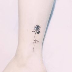 a single rose tattoo on the ankle